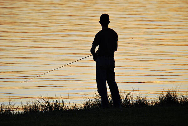 Fisherman Art Print featuring the photograph Silhouetted Fisherman by Teresa Blanton