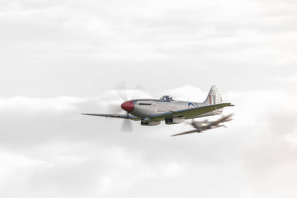 Silver Spitfire Art Print featuring the photograph Silver Spitfire in a cloudy sky by Gary Eason