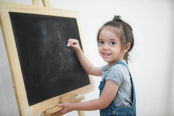 School Art Print featuring the photograph Smile girl draw cartoon with chalk and blackboard by Anek Suwannaphoom