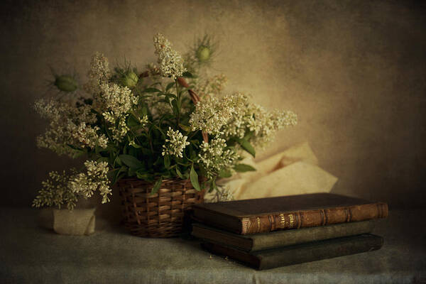 Still Life Art Print featuring the photograph Still life with old books and white flowers in the basket by Jaroslaw Blaminsky