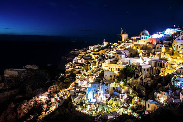 Greece Art Print featuring the photograph The lights of Oia in Santorini by Matt McDonald
