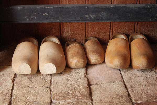Clogs Art Print featuring the photograph Wooden clogs by Emanuel Tanjala