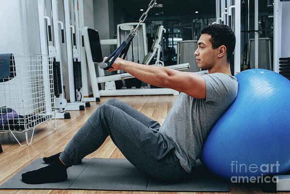 Man Art Print featuring the photograph Man Exercising In Gym #1 by Peakstock / Science Photo Library