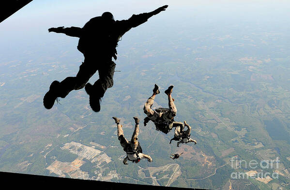 People Art Print featuring the photograph Navy Seals Jump From The Ramp Of A C-17 #3 by Stocktrek Images
