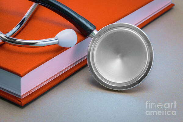 Book Art Print featuring the photograph Stethoscope Next To A Book #3 by Digicomphoto/science Photo Library