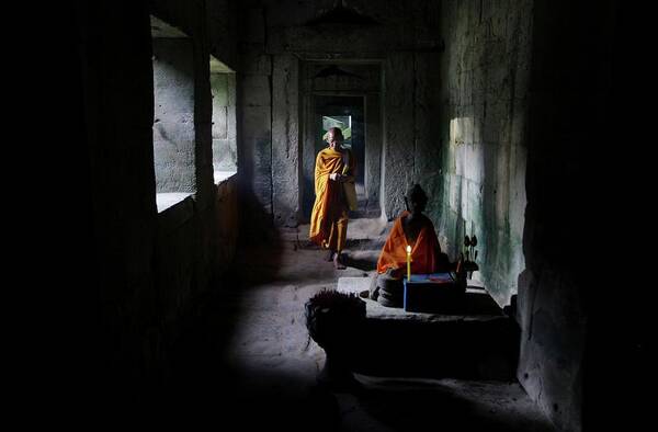 Young Men Art Print featuring the photograph Buddhist Monk At Angkor Wat Temple #4 by Timothy Allen