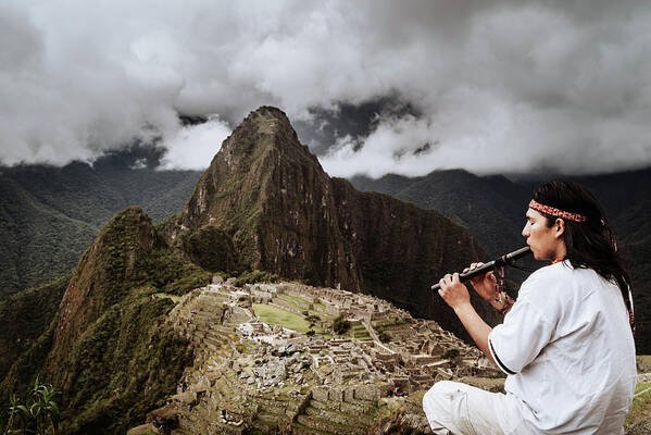 Machu Picchu Art Print featuring the photograph A flutist at Macchu Picchu in Peruian Highlands by Kamran Ali