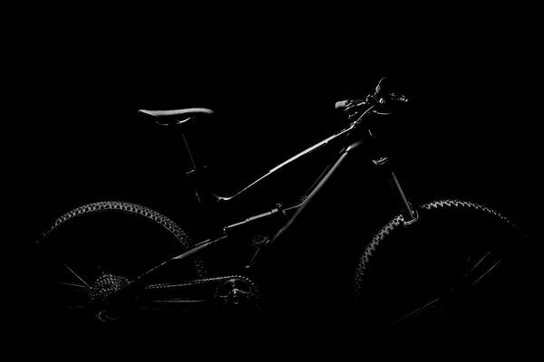 Black Background Art Print featuring the photograph Black And White Mountain Bike In Studio by Stuart Ashley