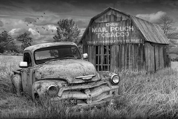 Chevy Art Print featuring the photograph Black and White of Rusted Chevy Pickup Truck in a Rural Landscape by a Mail Pouch Tobacco Barn by Randall Nyhof