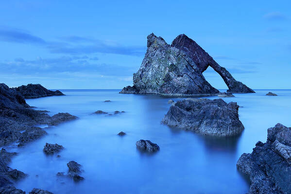 Water's Edge Art Print featuring the photograph Bow Fiddle Rock, Natural Arch On Moray by Sara winter