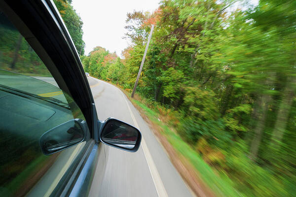 Blurred Motion Art Print featuring the photograph Car Driving Along A Country Road by Antonio M. Rosario