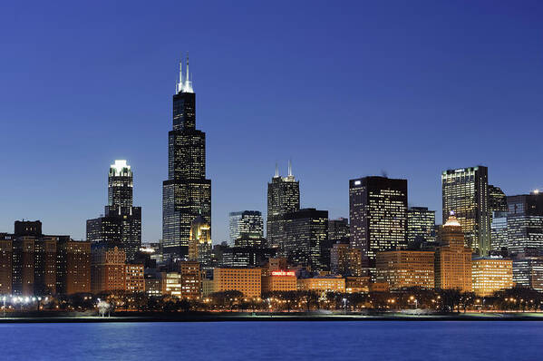 Lake Michigan Art Print featuring the photograph Chicago Skyline And Sears Tower At Dusk by Michele Falzone