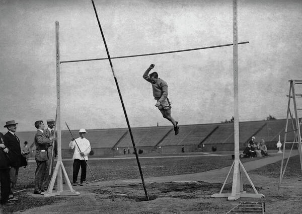 Pole Vault Bar Art Print featuring the photograph Clearing The Bar by Paul Thompson/fpg