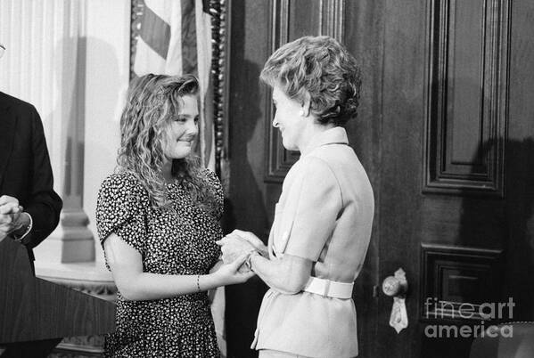 1980-1989 Art Print featuring the photograph Drew Barrymore With Nancy Reagan by Bettmann