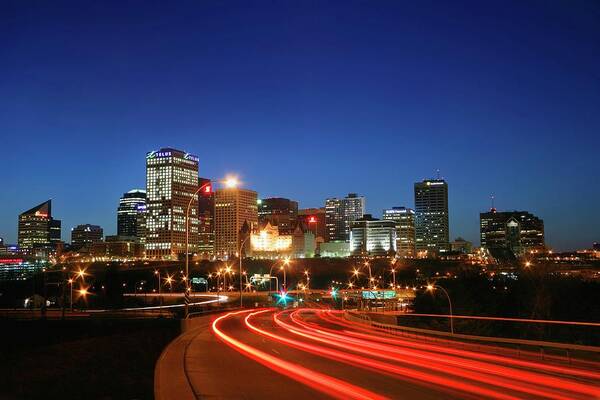 Scenics Art Print featuring the photograph Edmonton Skyline With Lights On Road by Design Pics