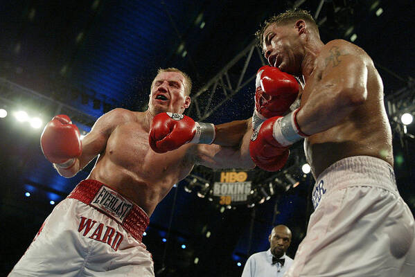 Punching Art Print featuring the photograph Gatti And Ward Trade Punches by Al Bello