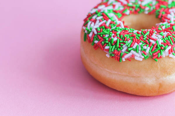 Unhealthy Eating Art Print featuring the photograph Glzed Donut With Sprinkles On A Pink by Steven Errico