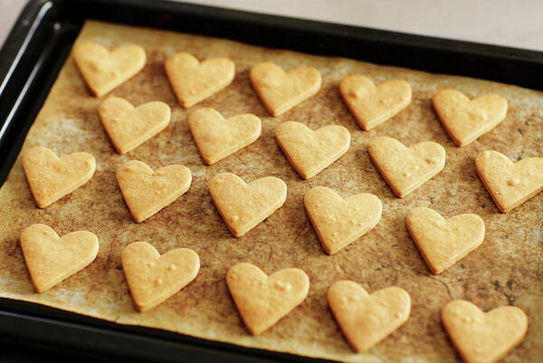 In A Row Art Print featuring the photograph Heart Cookies On Oven Tray by Sot