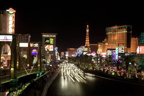 Las Vegas Replica Eiffel Tower Art Print featuring the photograph Las Vegas At Night by Thinkstock Images