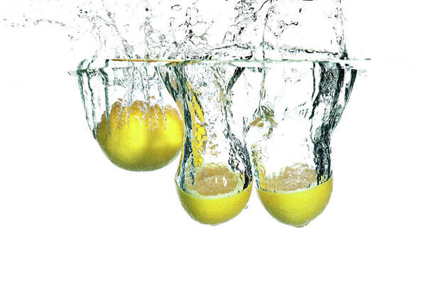 Cut Out Art Print featuring the photograph Lemons Falling In Water Isolated On by Amriphoto