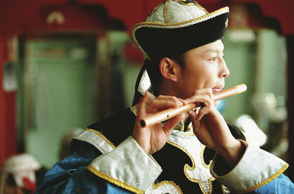 Mongolian Culture Art Print featuring the photograph Man Playing Flute In Theatre, Profile by Peter Adams