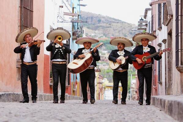 Mature Adult Art Print featuring the photograph Mariachi Band Walking In Street by Pixelchrome Inc