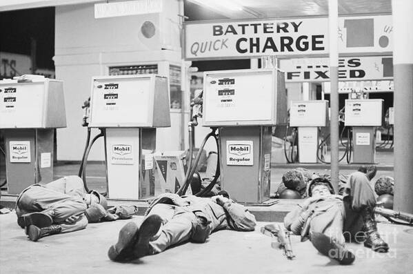 Working Art Print featuring the photograph Natl Guardsmen Sleeping Near Gas Pumps by Bettmann