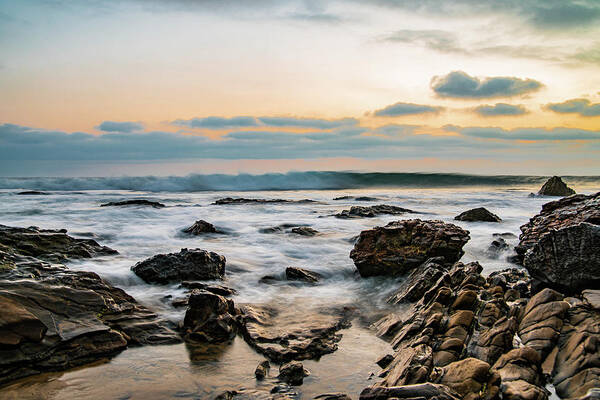 Local Snaps Photography Art Print featuring the photograph Painted waves on rocky beach sunset by Local Snaps Photography