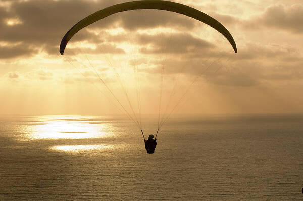 Photography Art Print featuring the photograph Paraglider Flying In The Sky Over An by Panoramic Images