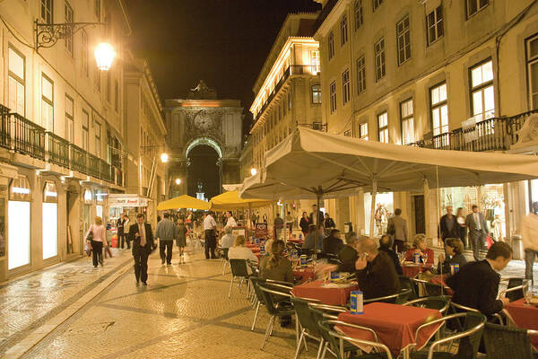 Estremadura And Ribatejo Art Print featuring the photograph People Sitting Outside Along Rua by Lonely Planet