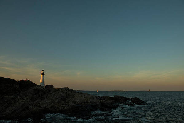 Maine Art Print featuring the photograph Portland Headlight In The Setting Sun On The Coast Of Maine by Cavan Images