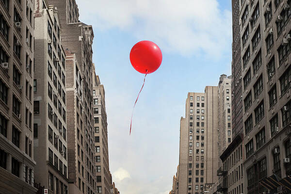 Apartment Art Print featuring the photograph Red Balloon Floating Through City by Thomas Jackson