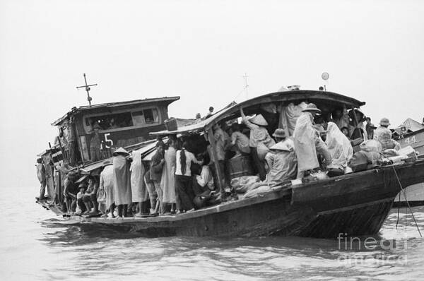 Mid Adult Women Art Print featuring the photograph Refugees Huddled On Boat In Rain Downpou by Bettmann