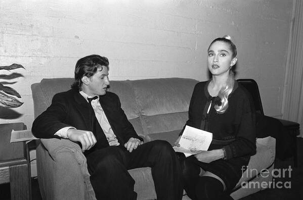 1980-1989 Art Print featuring the photograph Sean Penn And Madonna Sitting On Couch by Bettmann