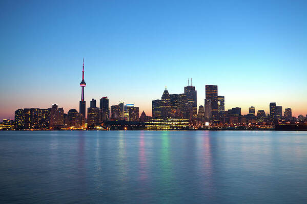 Water's Edge Art Print featuring the photograph Skyline Of Toronto By Night, Ontario by Espiegle