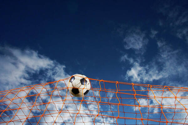 Working Art Print featuring the photograph Soccer Ball Going Into Goal Net by Fuse