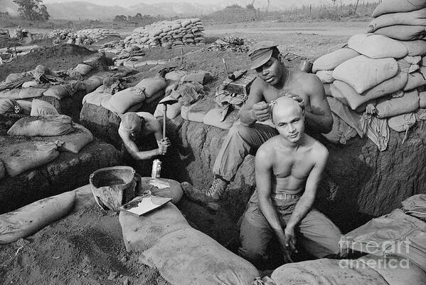 Vietnam War Art Print featuring the photograph Soldier Shaving Colleagues Head by Bettmann