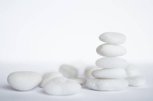 White Background Art Print featuring the photograph Stack Of White Pebbles On White by G.g.bruno