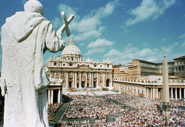 Crowd Of People Art Print featuring the photograph Statue Overlooking St. Peters Square by Bettmann