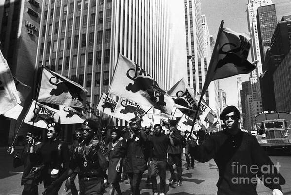 Marching Art Print featuring the photograph The Black Panthers March In New York by Bettmann