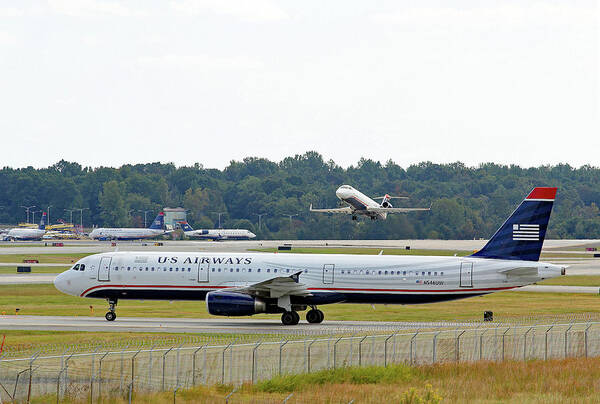 Us Airways Art Print featuring the photograph US Airways Takeoff by Joseph C Hinson