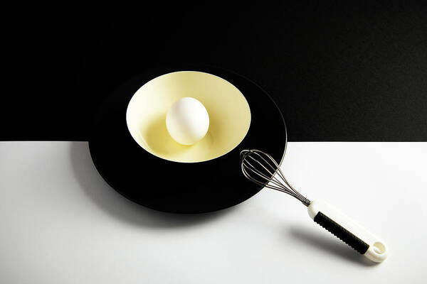 Egg Art Print featuring the photograph White egg on a yellow bowl. by Michalakis Ppalis