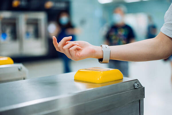 Subway Art Print featuring the photograph Cropped shot of young Asian woman checking in at subway station using contactless payment for subway ticket via smartwatch #1 by D3sign
