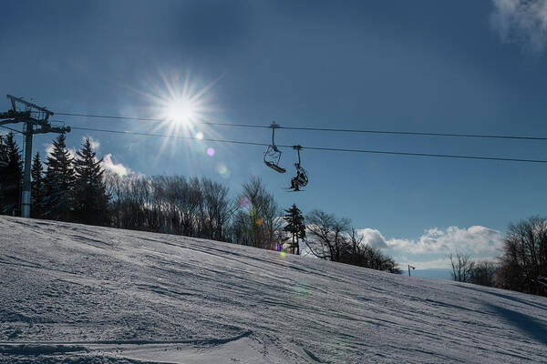 Ski Lift Art Print featuring the photograph Ski lift with sunburst on winter day by Dan Friend