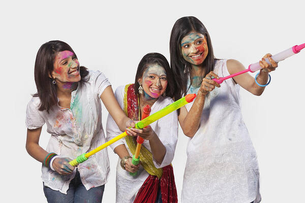 Hinduism Art Print featuring the photograph Three women playing holi #1 by Hemant Mehta