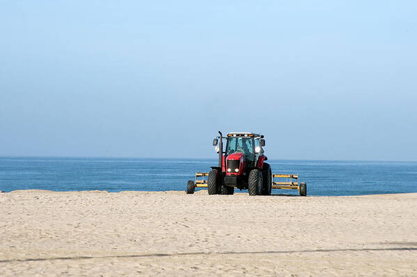 Beach Art Print featuring the photograph Tractor Cleaning the Sand on the Beach #1 by Mark Stout