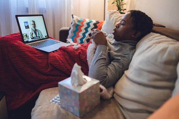 Laptop Art Print featuring the photograph Young ill African-American man having interaction with doctor over laptop #1 by Ika84