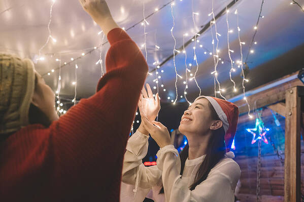 Celebration Art Print featuring the photograph 2 Asian Chinese Young Girl Installing Christmas String Light For The Party by Edwin Tan