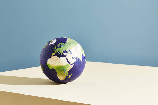 Continent Art Print featuring the photograph A world globe centred on Europe by Richard Drury