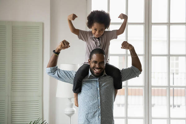 Boys Art Print featuring the photograph African ethnicity little son sitting on fathers shoulders showing biceps by Fizkes